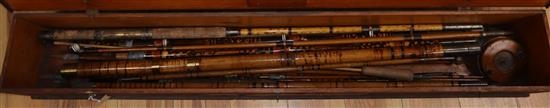 A cased group of bamboo cane fishing rods